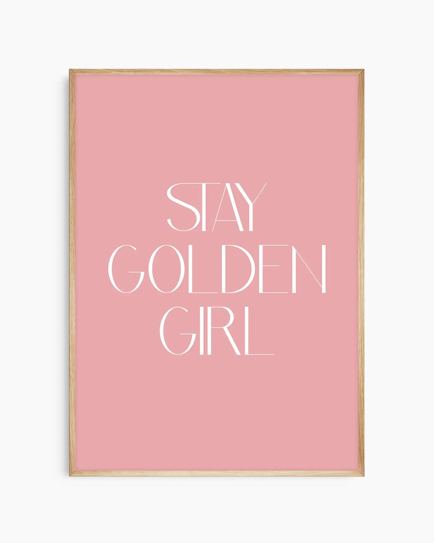 Nursery poster with 'Stay Golden Girl' text on a pink background framed in an oak frame