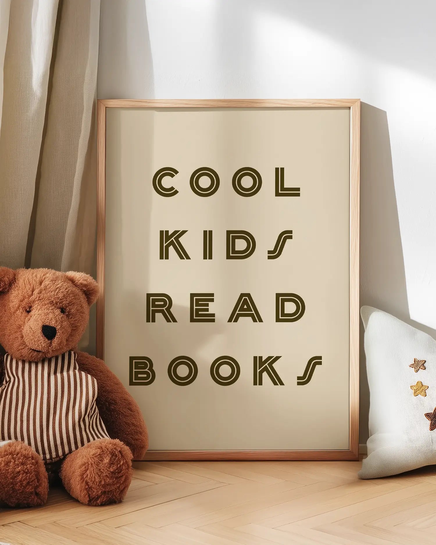 Poster with 'Cool kids read books' text next to a teddy bear on a wooden floor.