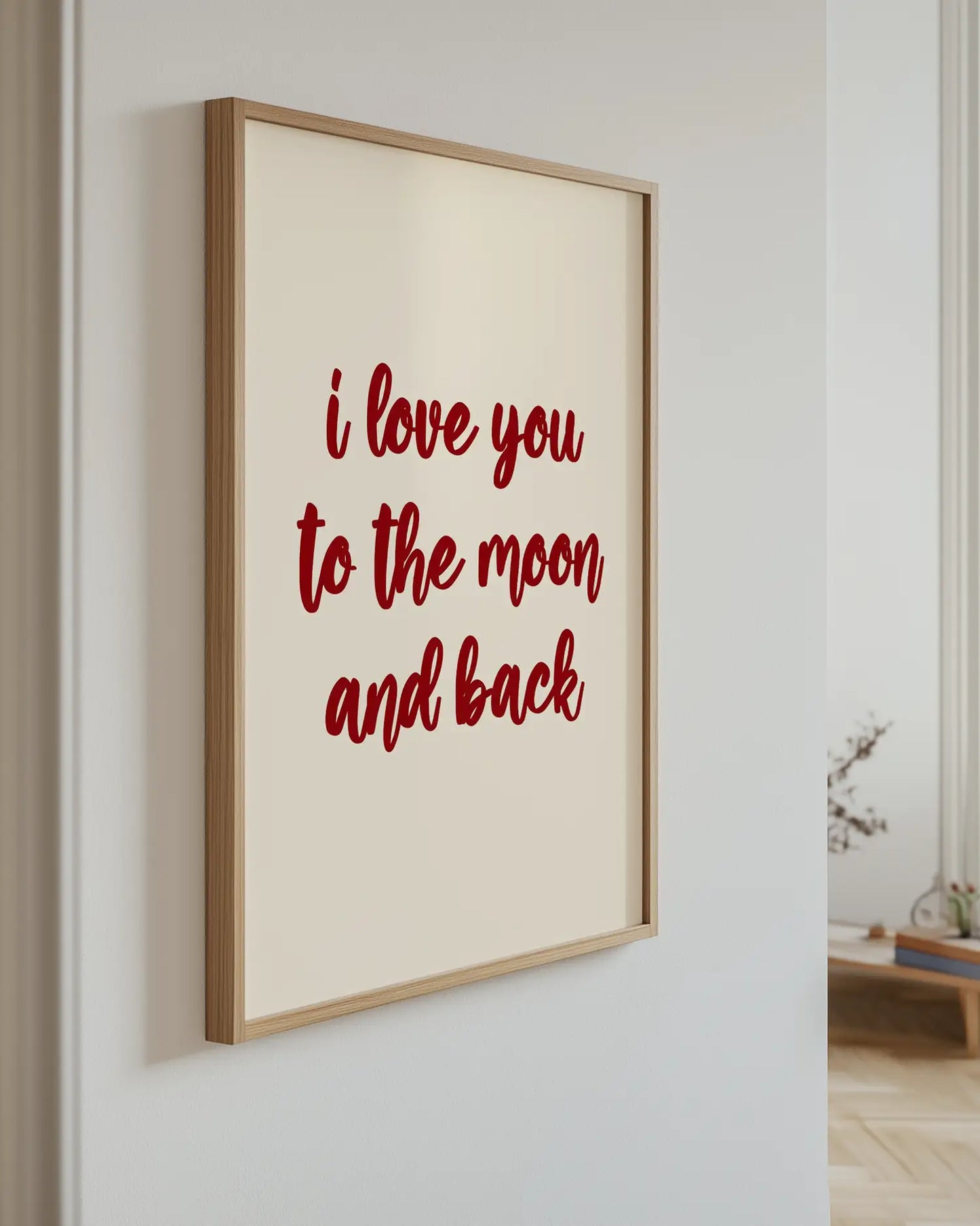 Poster with the text "i love you to the moon and back" on the wall