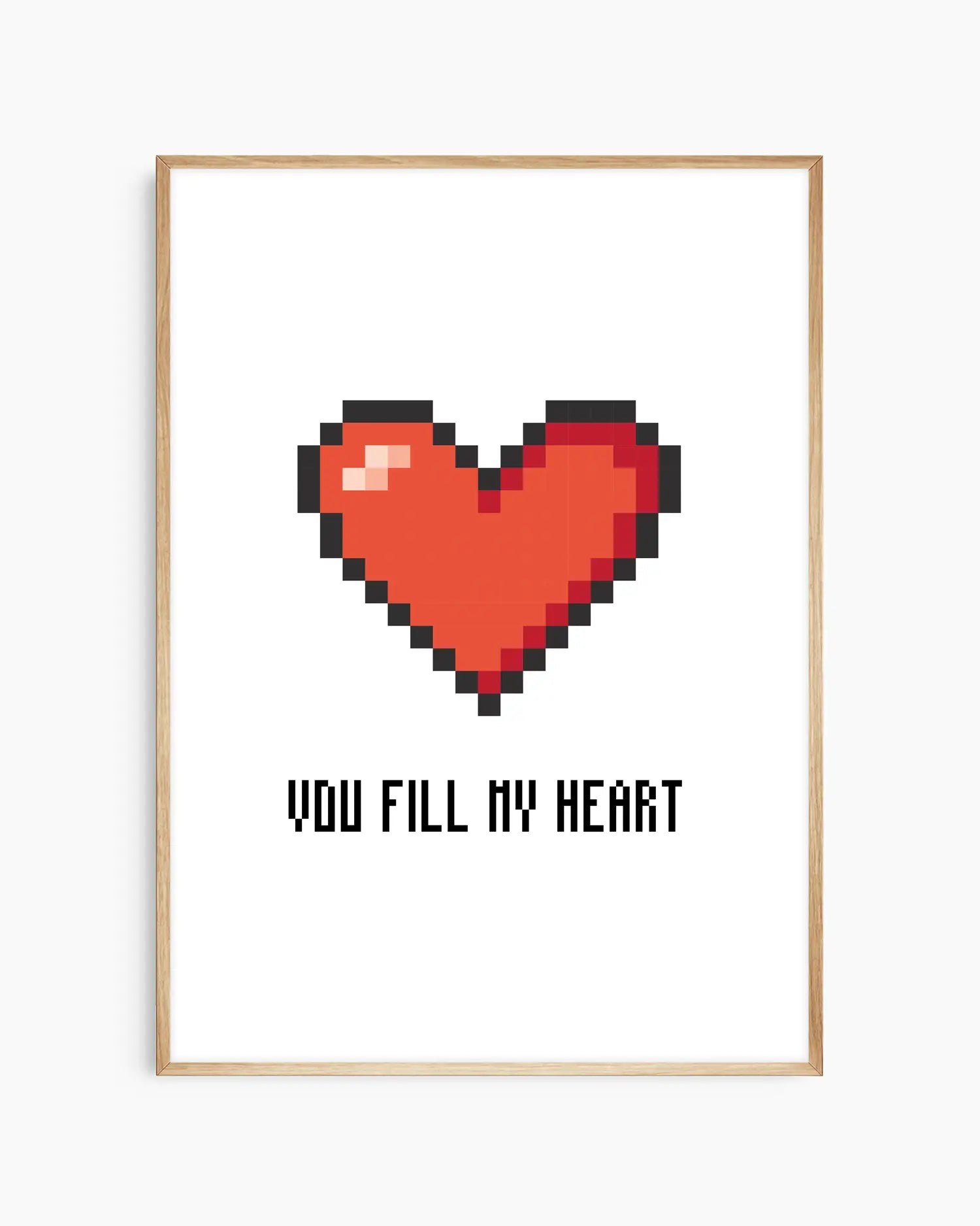 Nursery poster with a red pixel heart and the text 'You Fill My Heart' text on a white background, framed in an oak wooden frame.