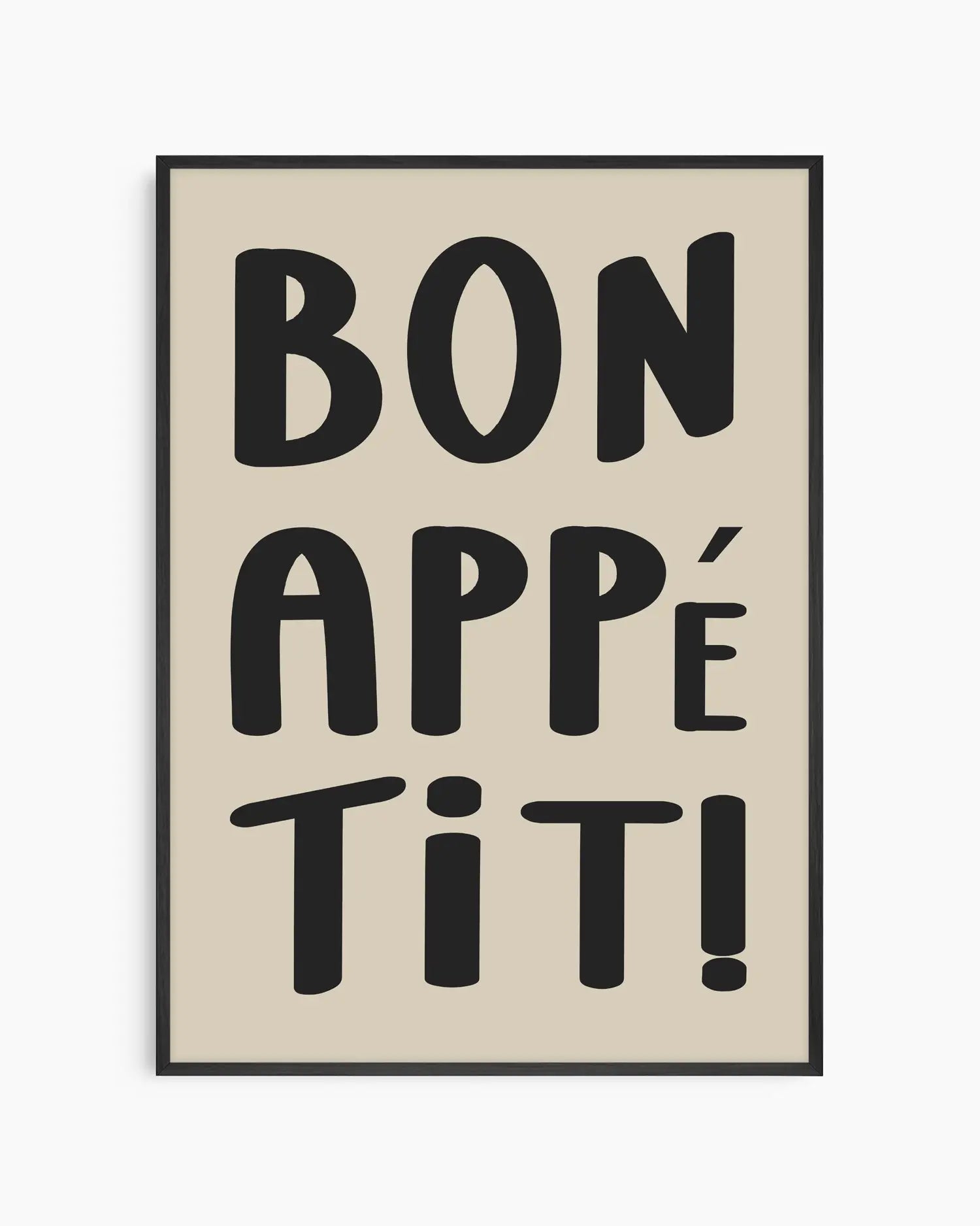Framed artwork with 'Bon Appétit!' text on a beige background in a black wooden frame.