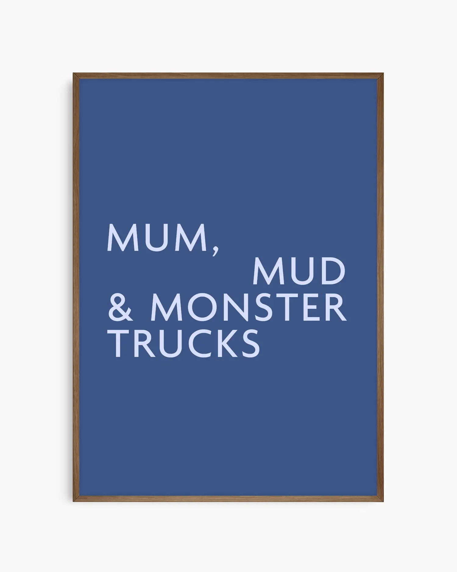 Poster with light blue text 'MUM, MUD & MONSTER TRUCKS' on a dark blue background in a smoked oak wooden frame.