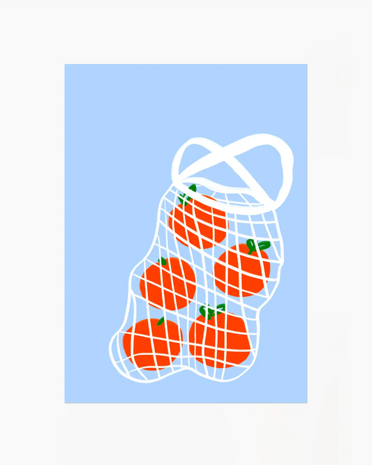 Net bag with tomatoes on a light blue background