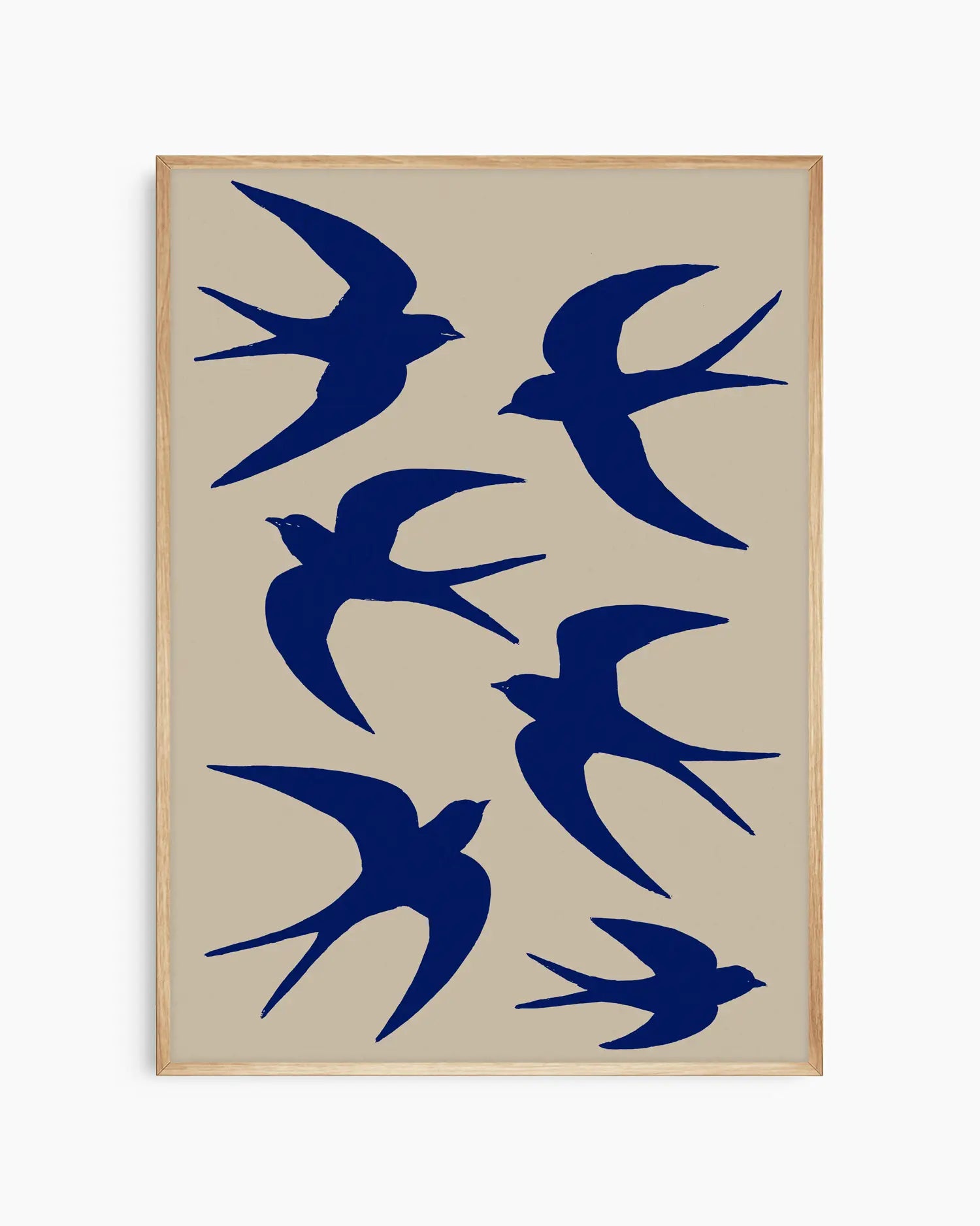 Framed artwork with blue bird silhouettes on a beige background