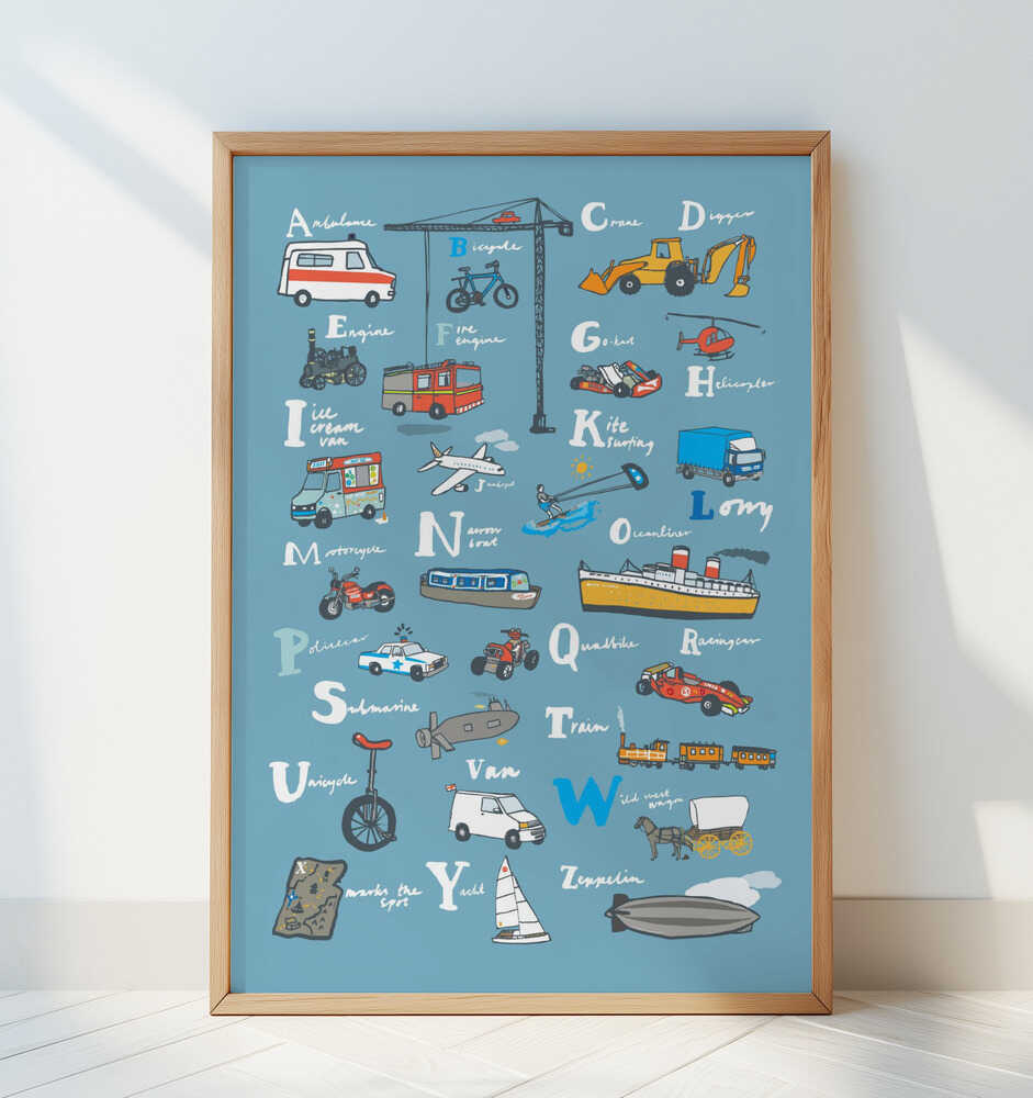 Playful alphabet poster for kids showing hand-drawn cars, trucks, planes, and boats for each letter from A to Z. Framed in light wood and leaning against a white wall — fun and educational wall art for a nursery or playroom.