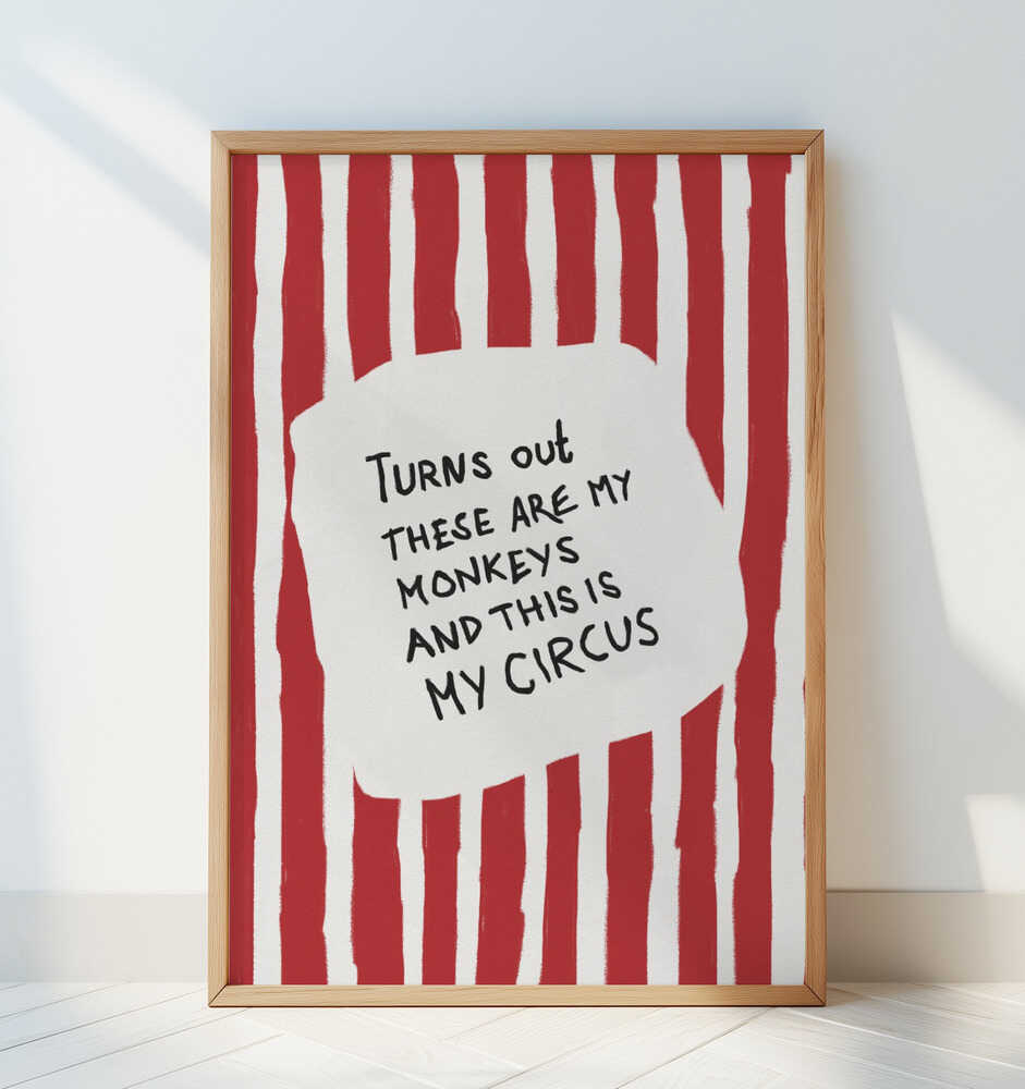 Nursery poster with the text 'Turns out these are my monkeys and this is my circus' on a red and white striped background leaning against a white wall.