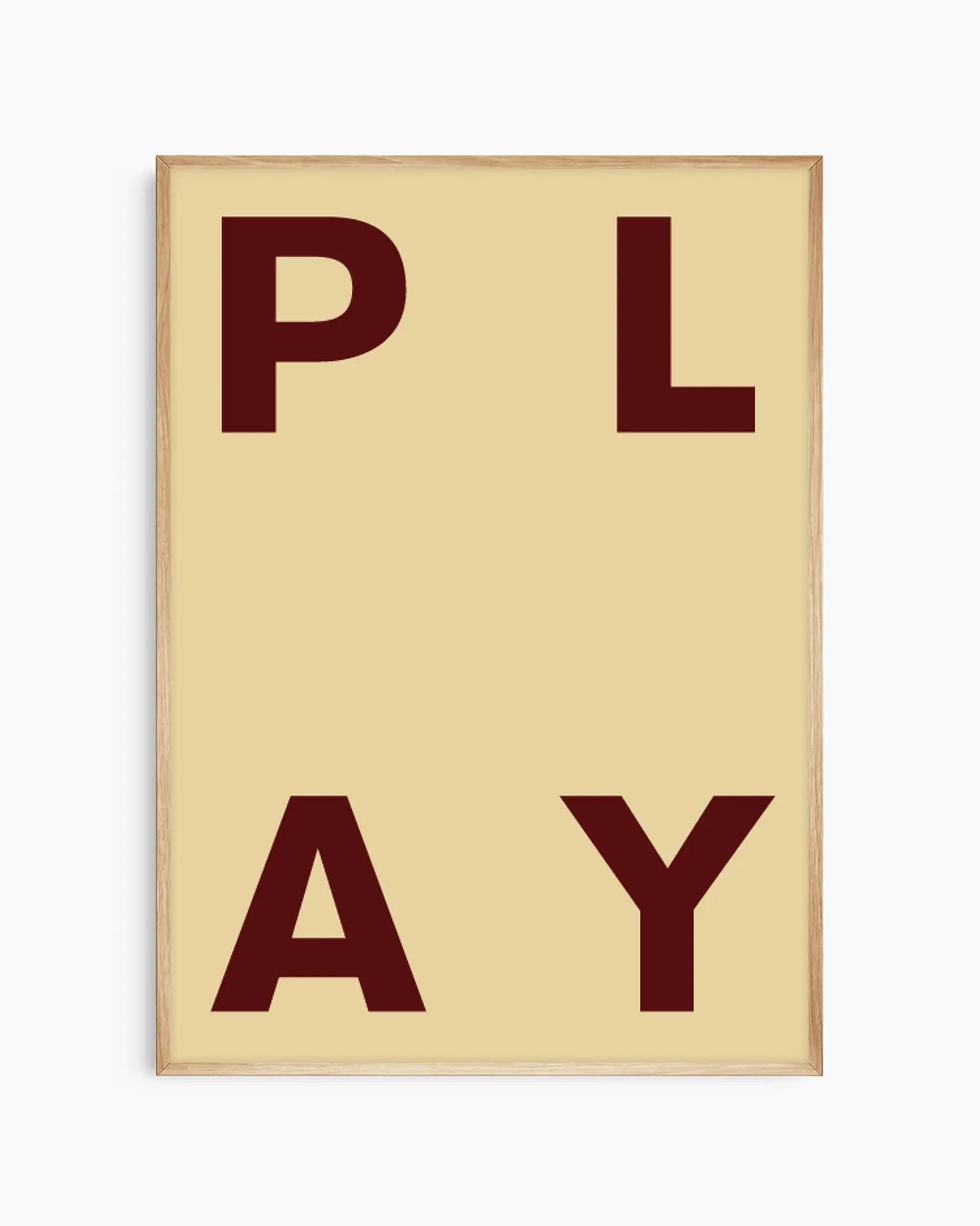 Beige nursery poster with maroon letters spelling 'PLAY' on a beige background framed in an oak frame.