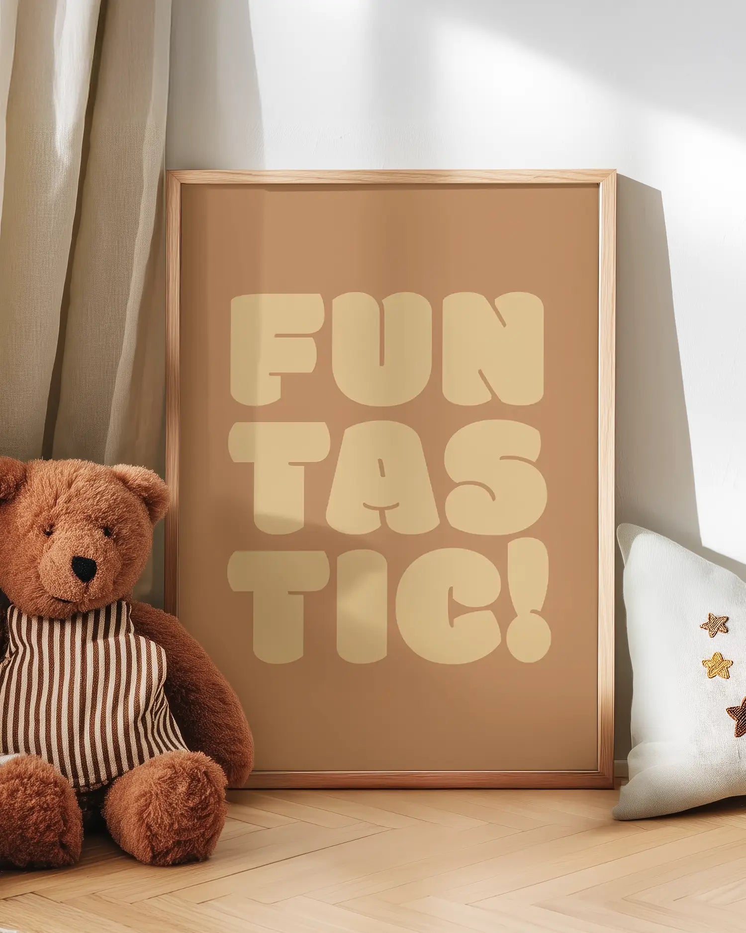 Poster with 'FUN TASTIC!' text next to a teddy bear on a wooden floor.