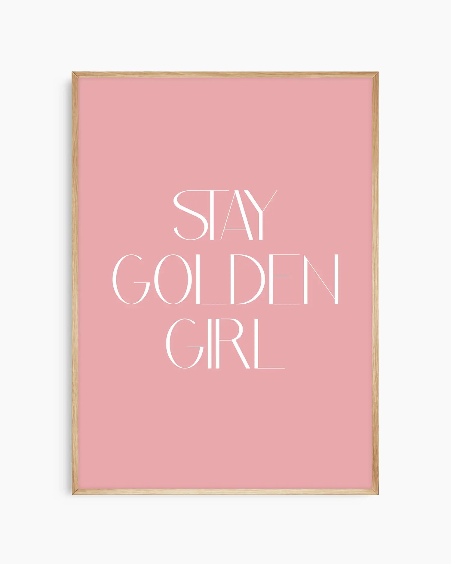 Nursery poster with 'Stay Golden Girl' text on a pink background framed in an oak frame