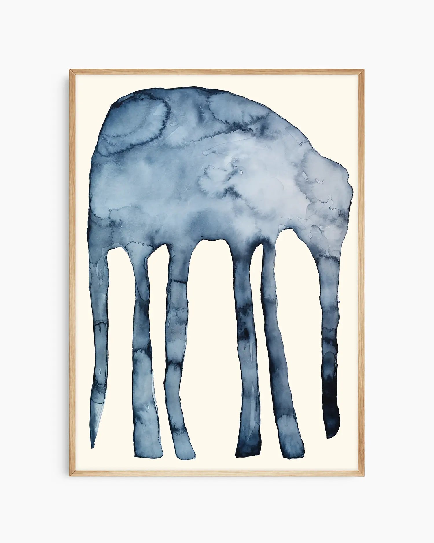 Blue watercolor painting of an elephant on a beige background inside of an oak frame