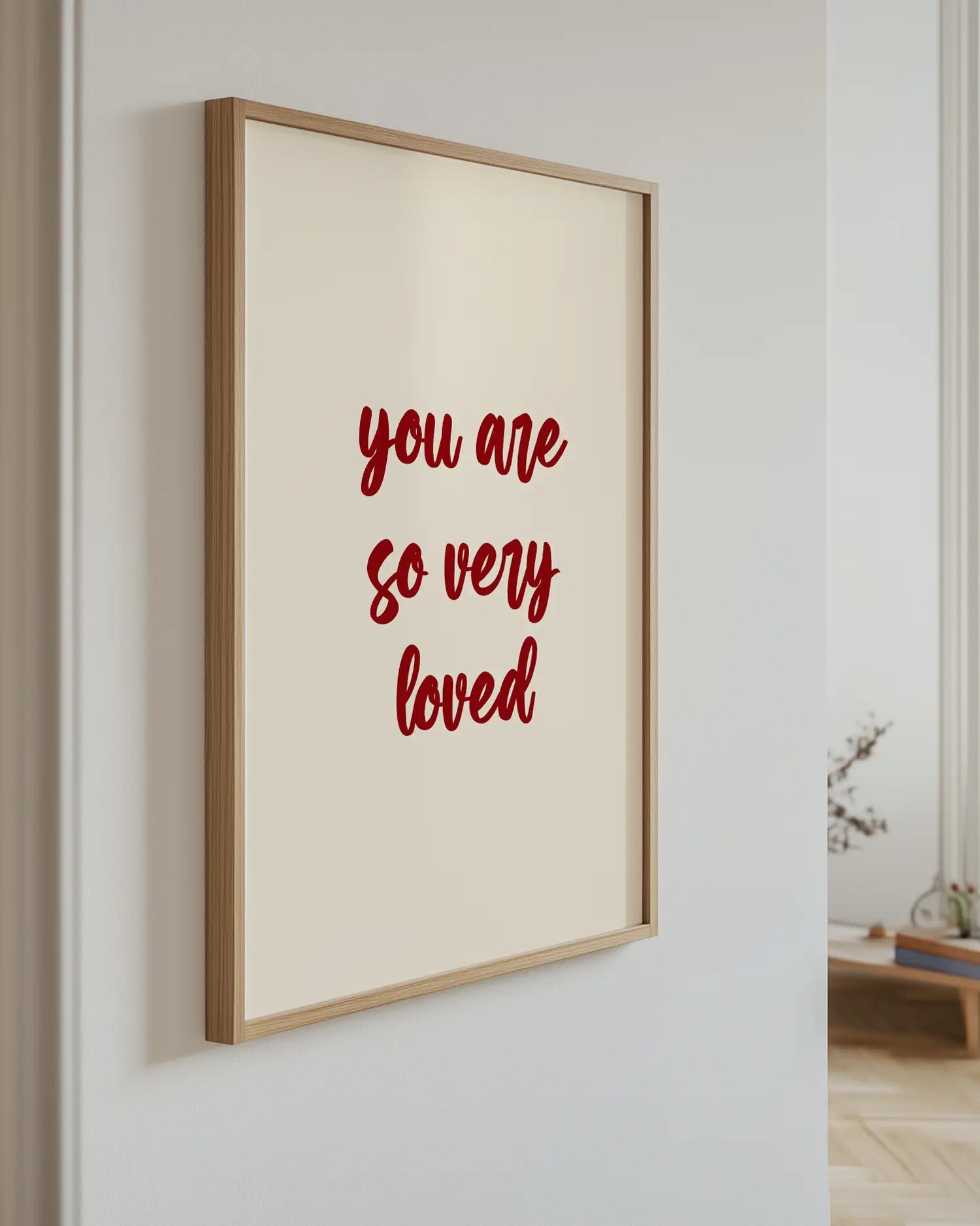 Poster with the text "you are so very loved" on the wall