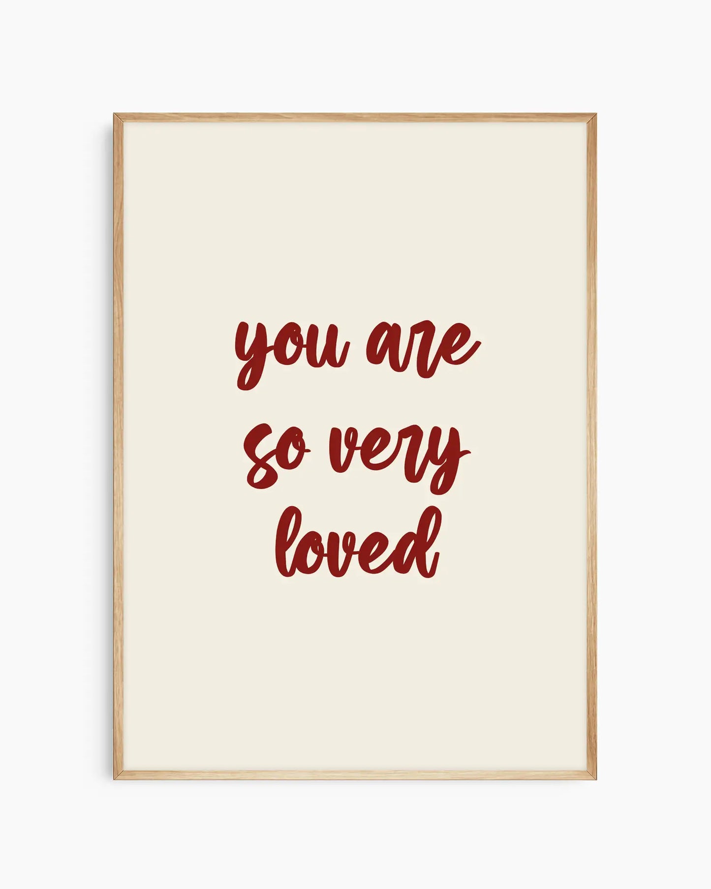 Nursery poster with red 'you are so very loved' text on a beige background. Oak frame.