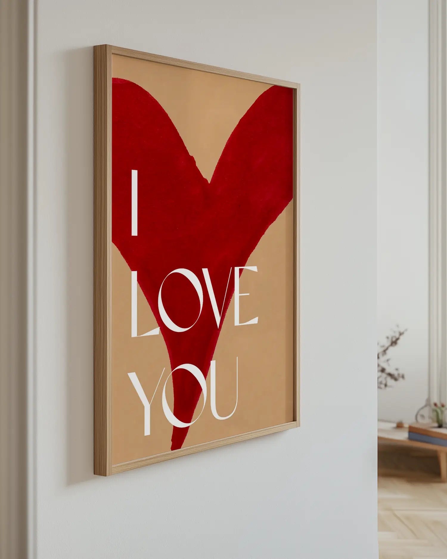 Poster with a red heart and the text "I Love You" on the wall