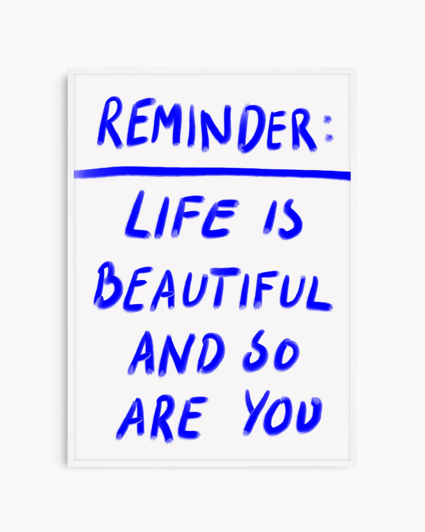 Framed poster with motivational quote 'Reminder: Life is beautiful and so are you' in blue text on a white background
