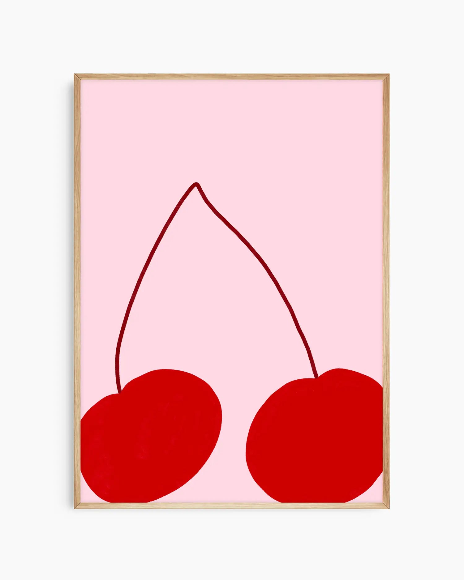 Framed artwork of two red cherries on a pink background