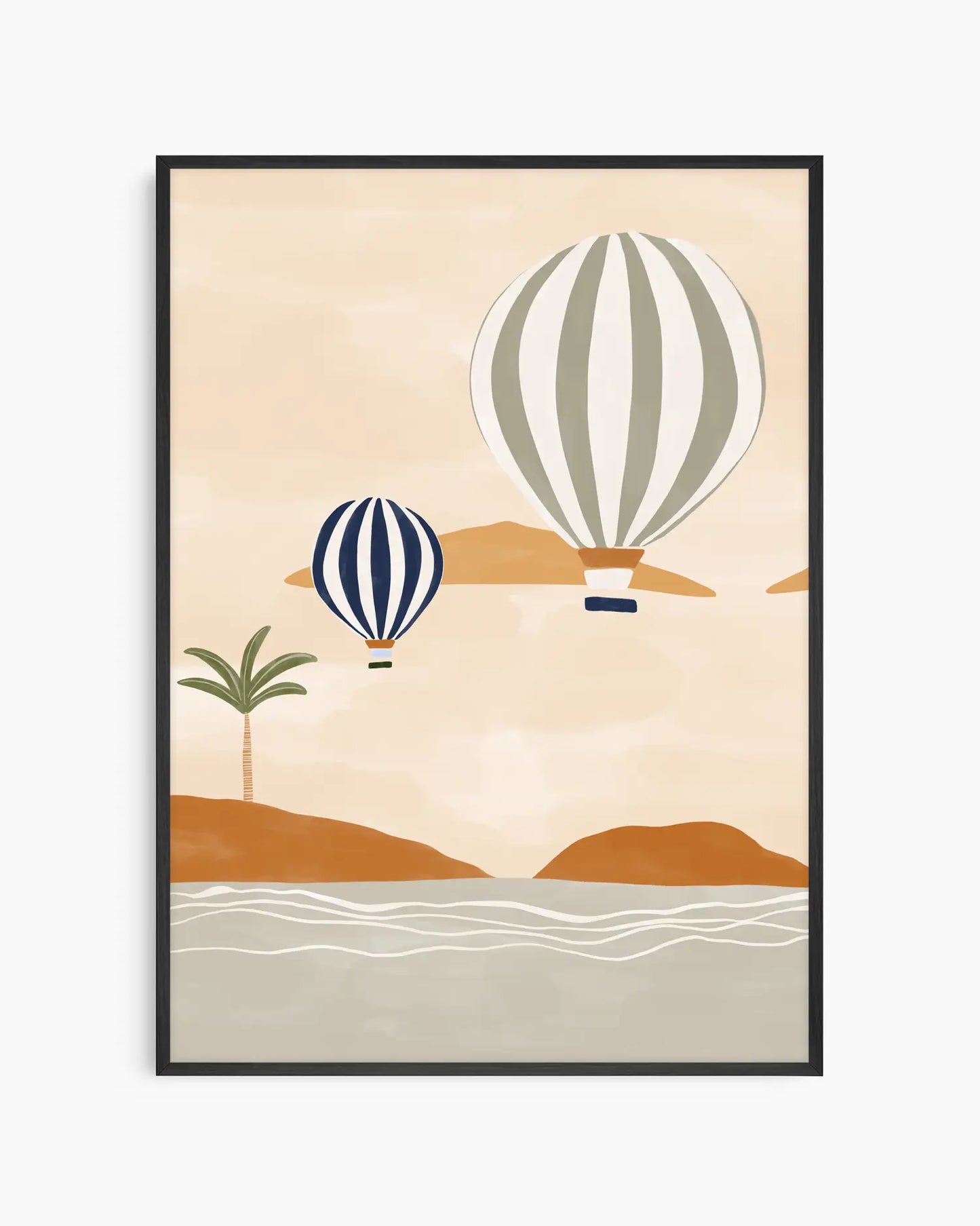 Framed artwork with two hot air balloons over a desert landscape on a beige background