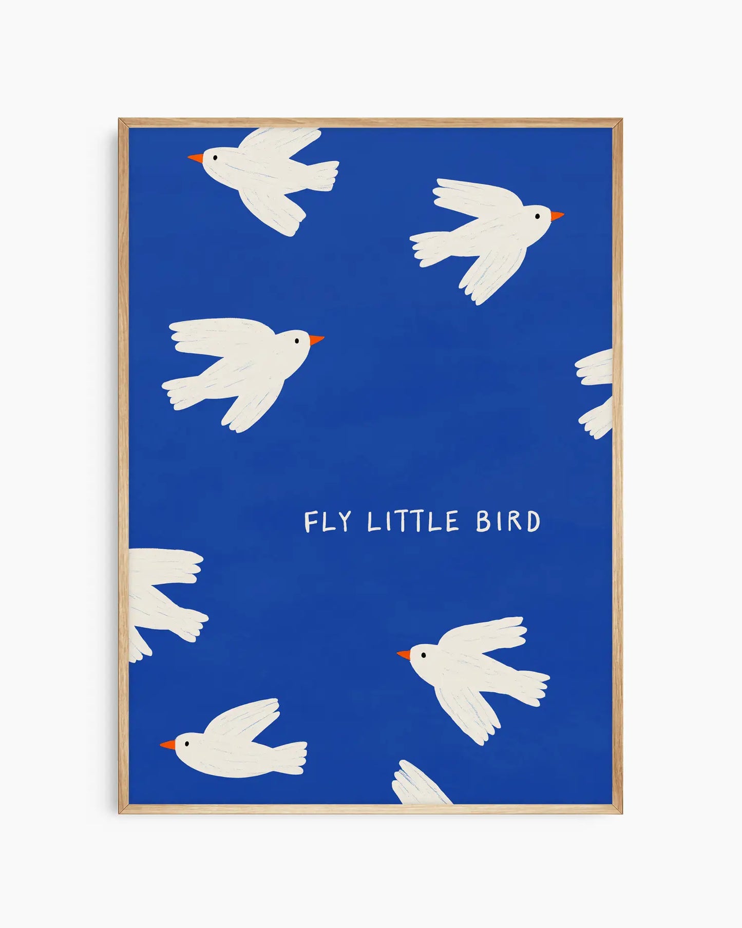 Framed artwork with white birds on a blue background and 'Fly Little Bird' text.