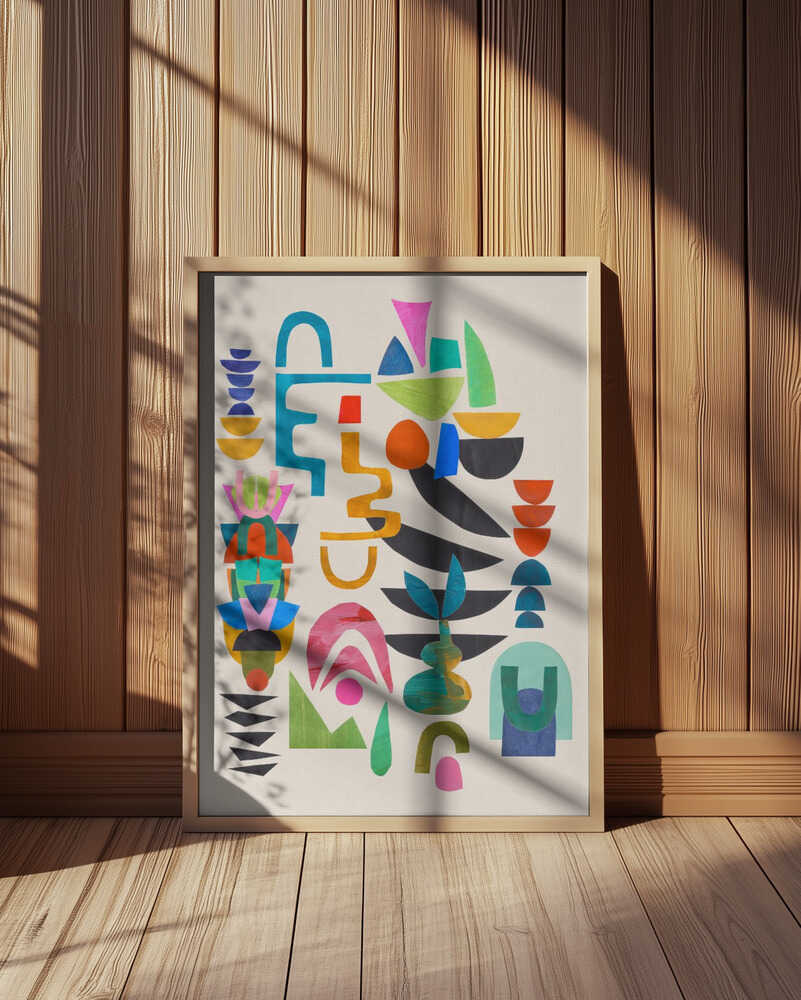 Colorful abstract art print featuring bold geometric shapes in blue, green, pink, yellow, and orange on a white background. Displayed in a light wooden frame leaning against a wooden wall with soft natural sunlight and shadows. Modern wall art perfect for creative Scandinavian interiors.