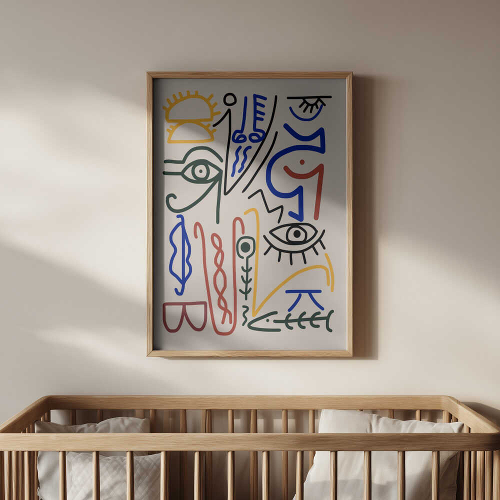 Modern abstract line art poster featuring bold, colorful shapes and minimalist faces, framed in light wood and hanging above a baby’s crib. A stylish and imaginative wall art addition for a design-forward nursery.
