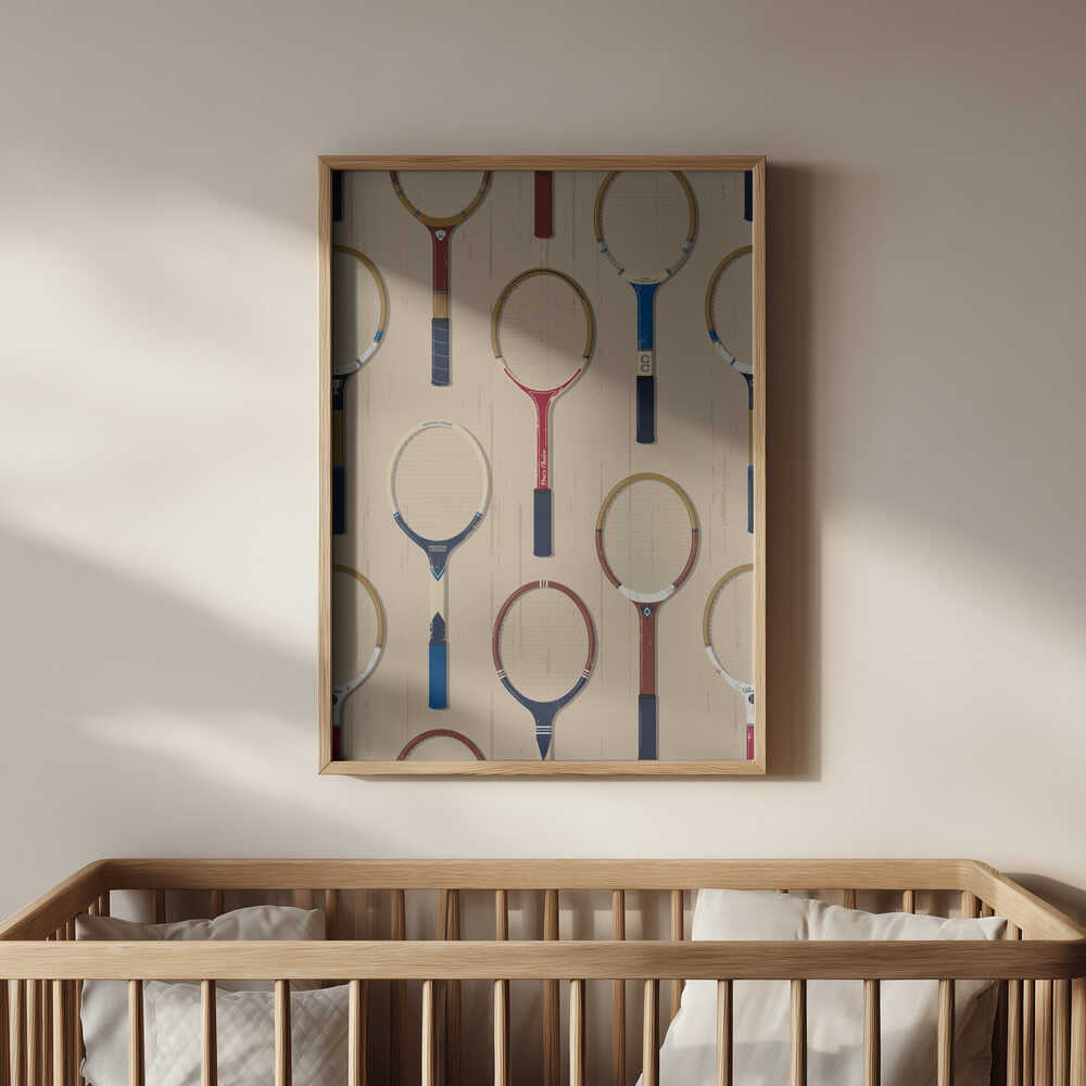 Framed poster of badminton rackets hanging in the nursery above the baby's crib.